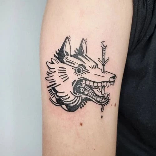 10. Small Wolf Tattoo